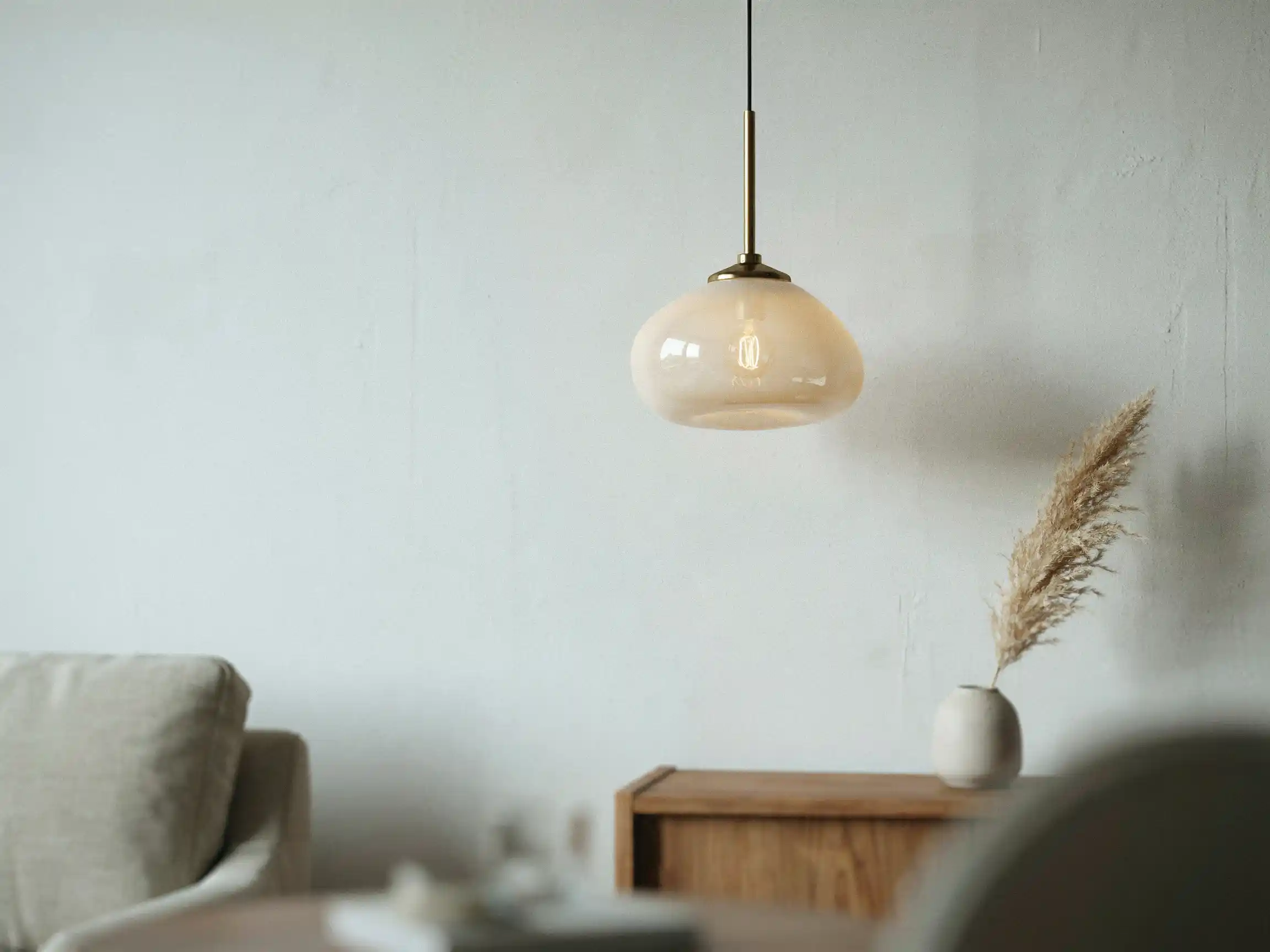 chic room decor neutral living room, chic statement lighting idea, chic layered textures decor